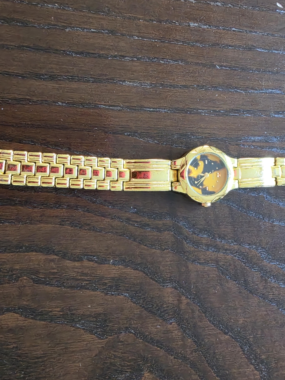 Geneva Gold Tone Women’s Watch with Black and Gold Dial